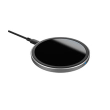 Wireless charging pad with attached power cable and dark charging surface