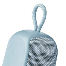 Blue portable Bluetooth speaker with tall wrist strap and textured fabric side grille