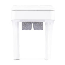 White outlet shelf with gray cord storage cutout in the front panel
