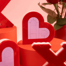 Red and pale pink heart brick sign piece with arched window detail