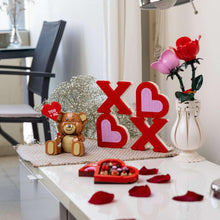Valentine XOXO brick sign with red and pale pink heart and X blocks on tabletop