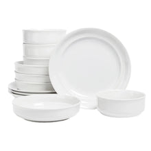 White glossy rimmed porcelain dinnerware set, stacked plates and bowls
