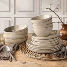 Ceramic 16-piece dinnerware set in beige, with plates and bowls stacked on tray