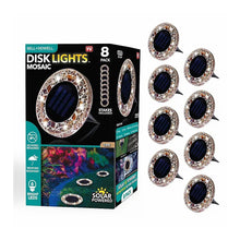 Set of 8 tan mosaic solar disk lights with dark solar panels and stake mounts