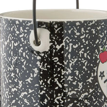 Ceramic teacher pail side close-up with black handle and speckled pattern