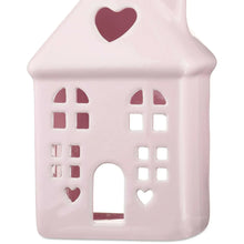 Pink ceramic house decoration with heart roof and arched door cutout
