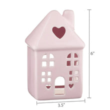 Pink ceramic house decoration, 6 in tall, heart roof with window cutouts