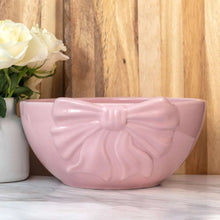 Pink ceramic bow serving bowl, glossy finish, front view