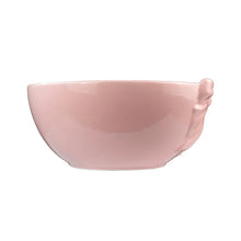 Pink ceramic serving bowl with smooth interior and rounded rim