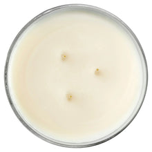 Unlit candle wax surface with three wicks in a clear top rim