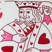Close-up red and white card-king illustration on decorative pillow