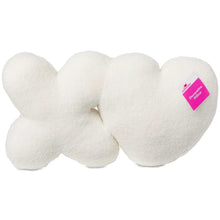 Decorative pillow in plush white heart-and-knot design, brand tag on side