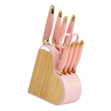 Heart-shaped knife block set, pink knife handles with gold tips on a wooden base.