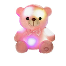 Pink teddy bear plush toy with glowing multicolor LEDs and stitched face