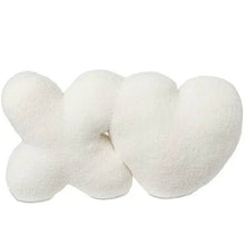 XO decorative pillow with plush white heart and knot shapes, soft fuzzy fabric