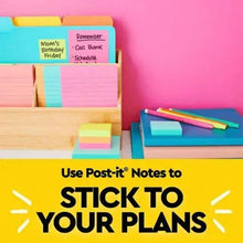 Colorful sticky note pads with small square notes in a row