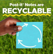 Blue sticky note square held in hand with white recycle arrows