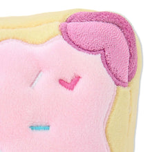 Close-up of pink plush with textured purple ear and heart sprinkle