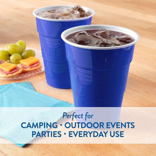 Blue disposable plastic cups with ice on table, 18 oz