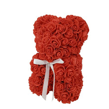 Red artificial rose bear with white ribbon bow, full front view