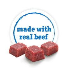 Wet dog food can label with red beef cubes and 'made with real beef' stamp