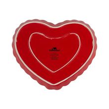 Red heart-shaped ceramic serving tray with white rim and Celebrate! text