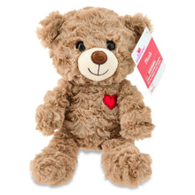 Brown bear plush with red heart on chest and white swing tag