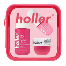 Holler travel body care essentials kit in pink hinged case with three bottles