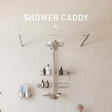 Shower caddy with multiple tiers of wire shelves and side hooks mounted to wall