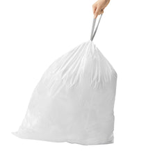 White custom-fit trash liner bag held open by hand