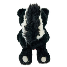 Black skunk plush with white belly spots and white paws, side view