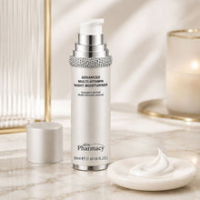 Night moisturizer bottle with silver sparkling collar and cream dollop in foreground