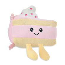 Pink strawberry cake plush with smiling face, tan base, and pink heart sprinkles