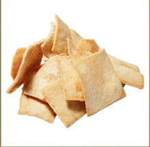 Stack of baked pita chips in light tan, folded crunchy pieces