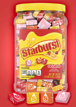 Starburst Original bulk candy jar with yellow cap and mixed wrapped pieces
