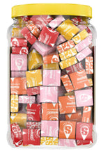 Starburst Original candy bulk jar with yellow cap filled with wrapped pieces