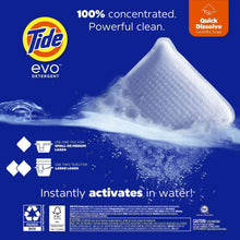 Laundry detergent fiber tile dissolving in water with visible soap bubbles