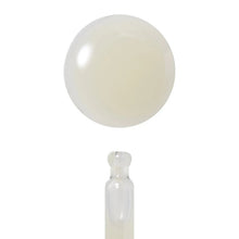 Retinol ampoule with pale cream swatch and dropper applicator