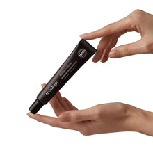 Retinol cream tube in hands, brown squeeze tube with ribbed cap