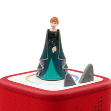 Elsa princess audio figurine with teal dress and dark cape, standing on red speaker top