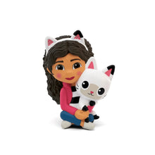 Audio toy figurine: girl holding a white cat with black patches, sitting pose
