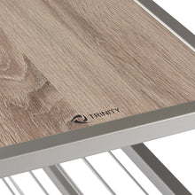 Wooden top of shoe bench with TRINITY logo on metal frame