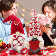 Two Valentine plush gnomes with heart fronts and knit hats, seated on tabletop
