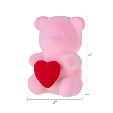 Pink flocked bear decoration, 2 in wide and 4 in tall, with red heart