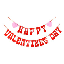 Valentine's Day banner with red letters and pink heart cutouts on strings