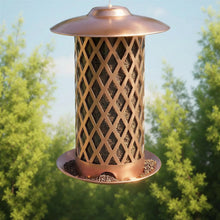 Copper-colored hanging bird feeder with lattice sides and metal base tray