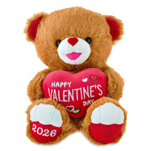 Tan teddy bear with white muzzle and pink Happy Valentine’s Day heart T-shirt.