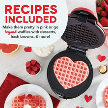 Heart waffle maker open with red heart waffle on nonstick grid plate