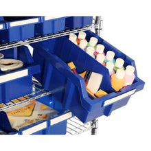 Rolling storage rack with wheels, blue bins and angled drawer for small supplies