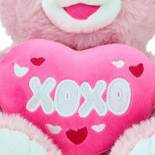 Pink teddy bear plush heart with XOXO stitched in white and red accents